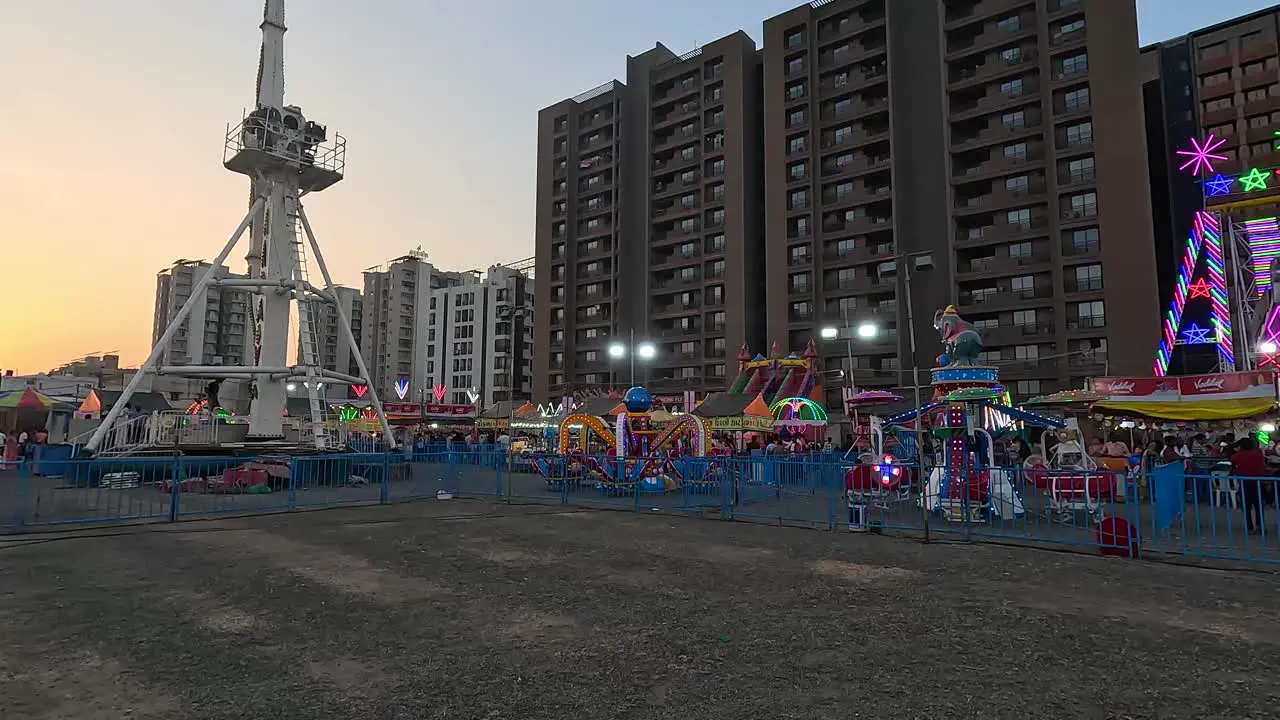 A scene of an amusement park at sunset that is completely empty