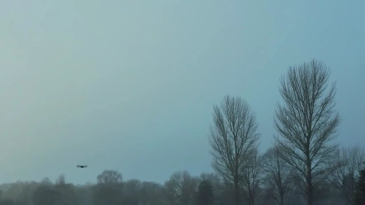 DJI drone in-flight on snowy field in Winter 2