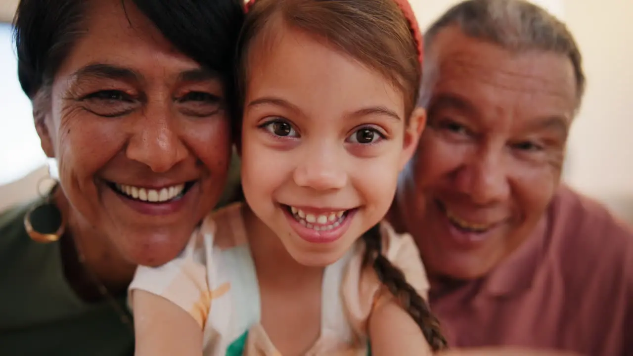 Grandparents girl child and selfie with face