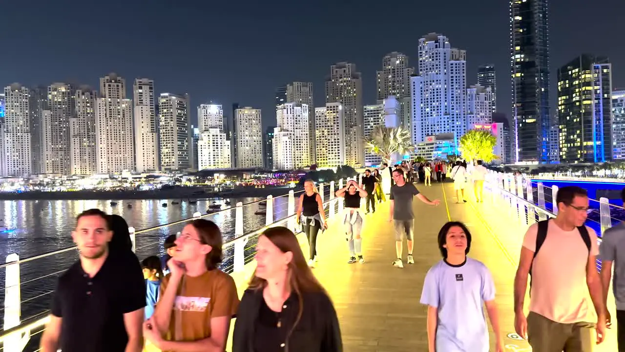 People enjoying the vibrant atmosphere of the new walking area on Bluewaters Island