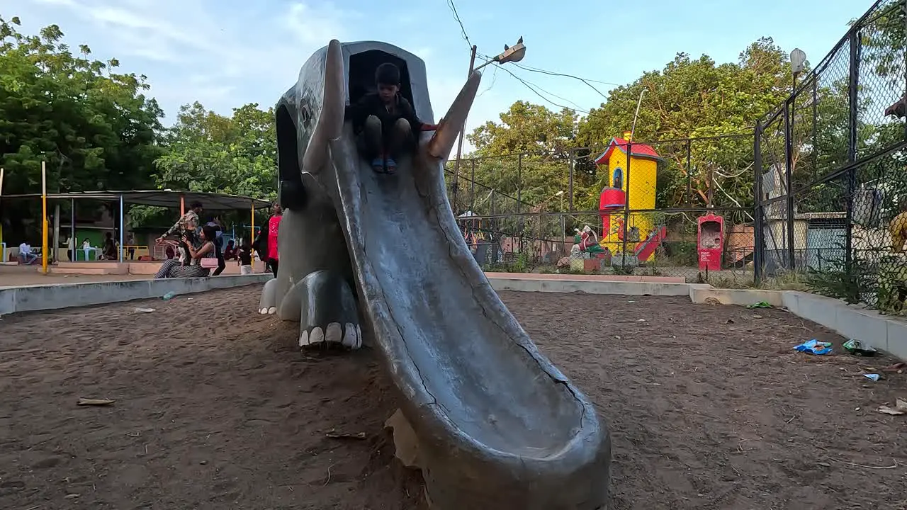 Little kids are enjoying the ride from the elephant ride in the public park