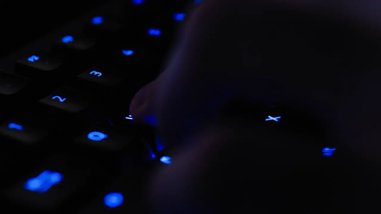 Colorful backlit Gaming Keyboard Gamer Typing WASD Close Up with illuminated vivid color shift