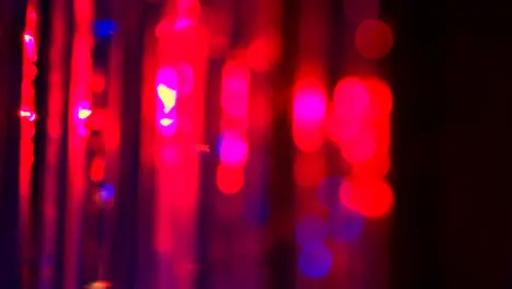 Defocused Close Up Shot Of Sparkling Tinsel Curtain In Night Club Or Disco With Flashing Strobe Lighting 4