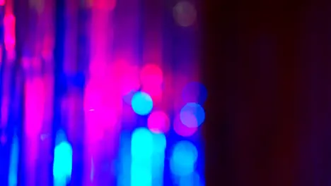 Defocused Close Up Shot Of Sparkling Tinsel Curtain In Night Club Or Disco With Flashing Strobe Lighting 3