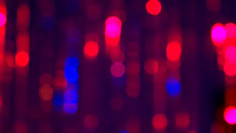 Defocused Close Up Shot Of Sparkling Tinsel Curtain In Night Club Or Disco With Flashing Strobe Lighting