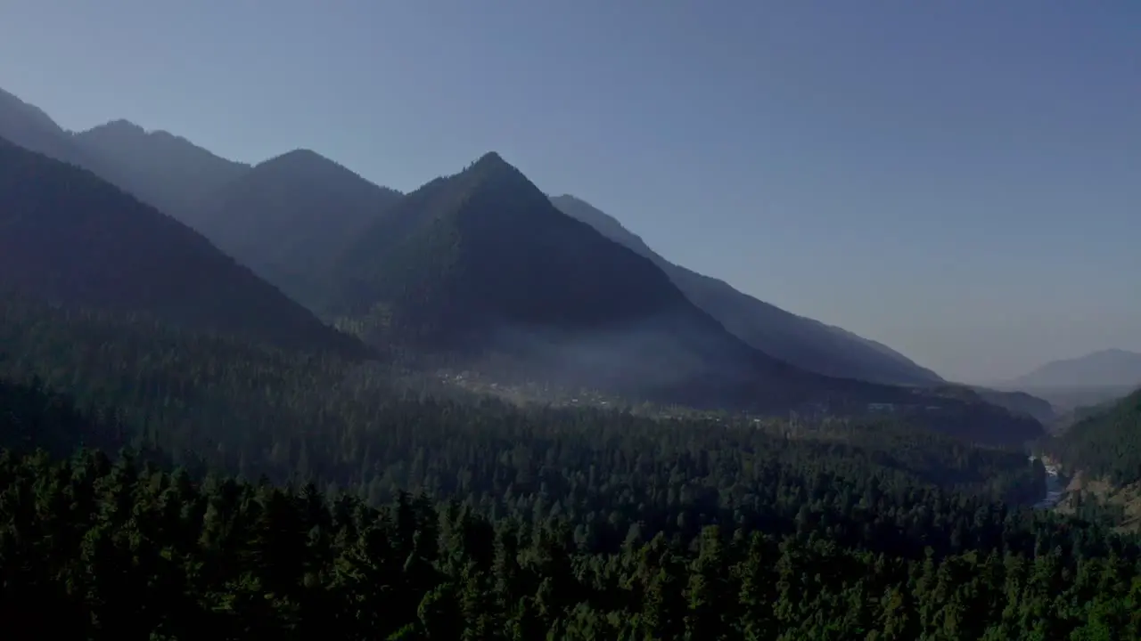 aerial drone view The drone camera is going to the back side where the mountains are visible