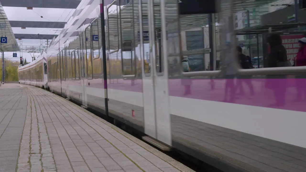 Clean public transit train arrives at train station in Kerava Finland