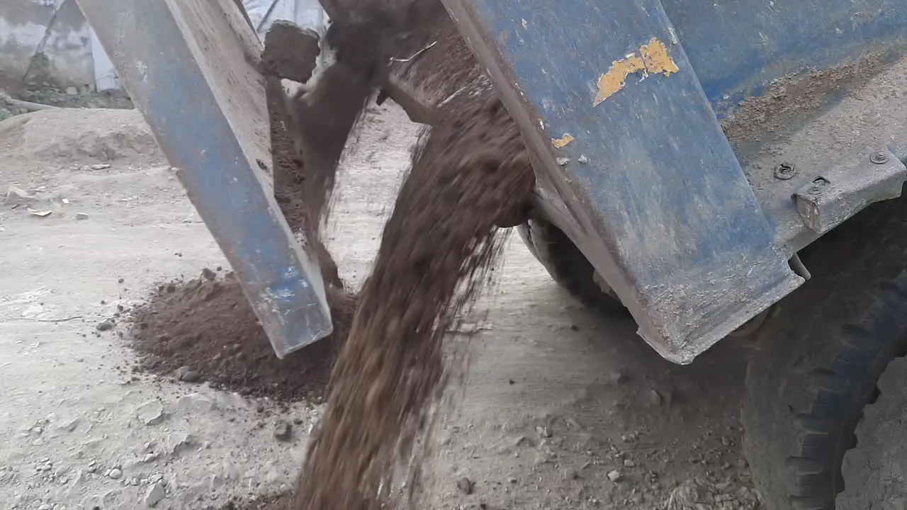 Dump Truck Unloads Sand in Construction