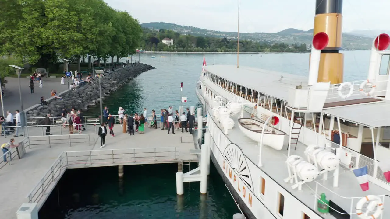 People deboarding a beautiful classic cruise ship on lake Geneva Switzerland