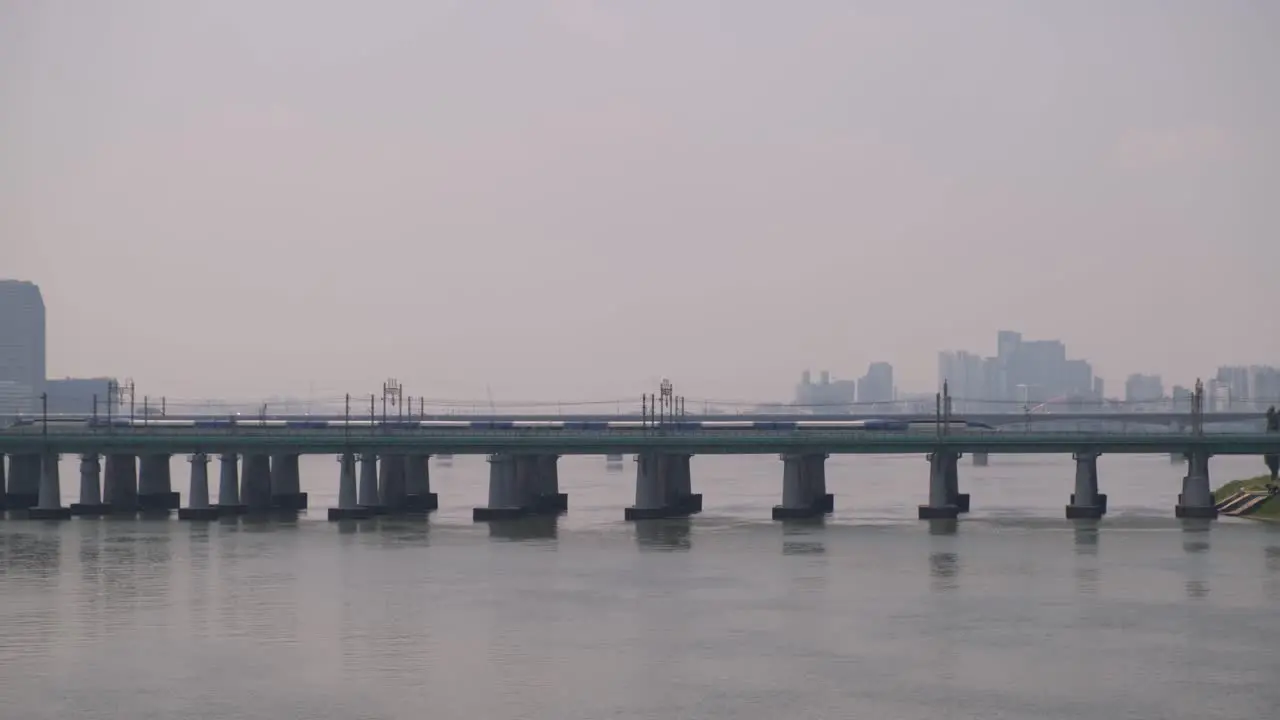 A train travels across the Gyeongbu Expressway and Han River in Seoul South Korea