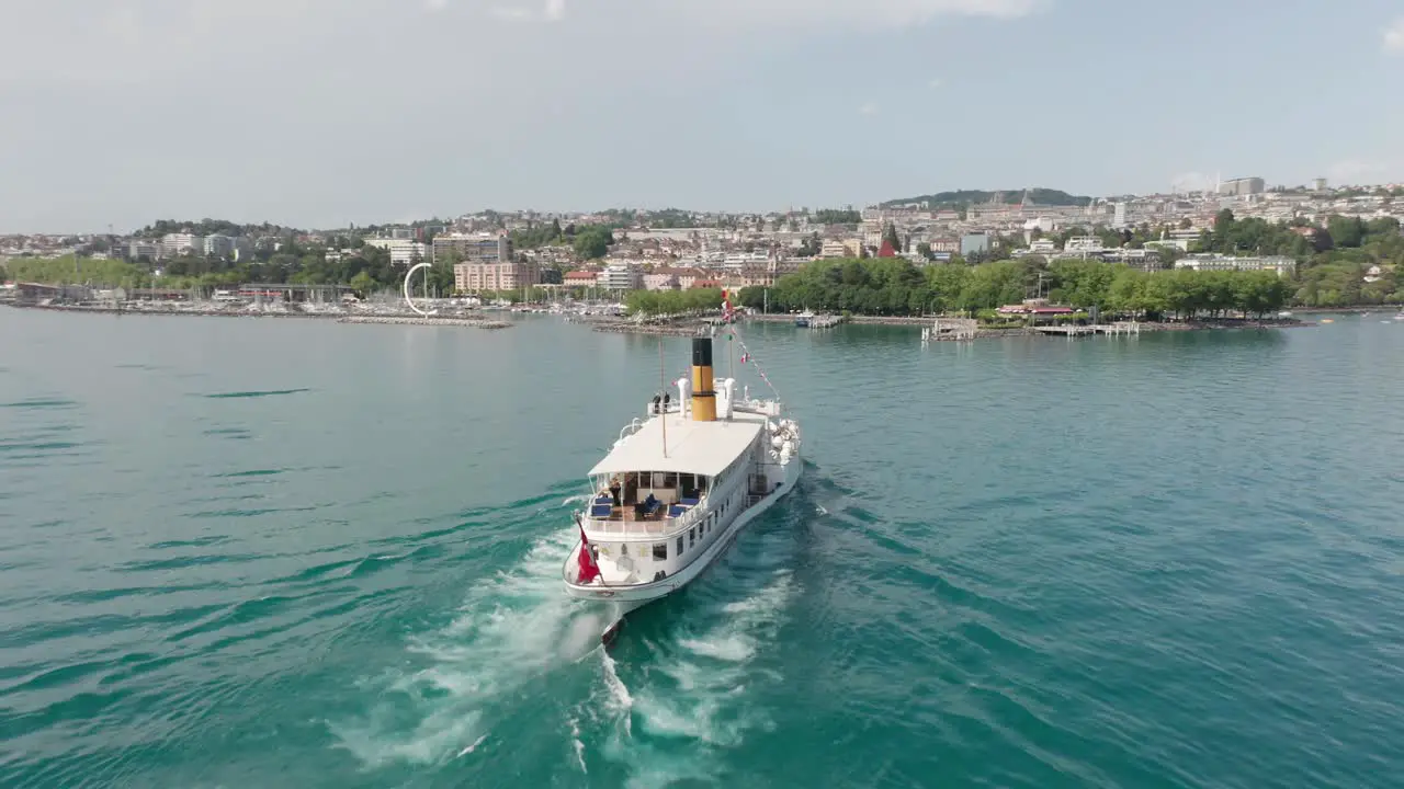 Aerial of beautiful old ferry sailing towards the city of Lausanne in Switzerland