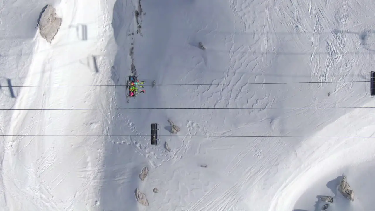 Skiers on Chairlift from Above