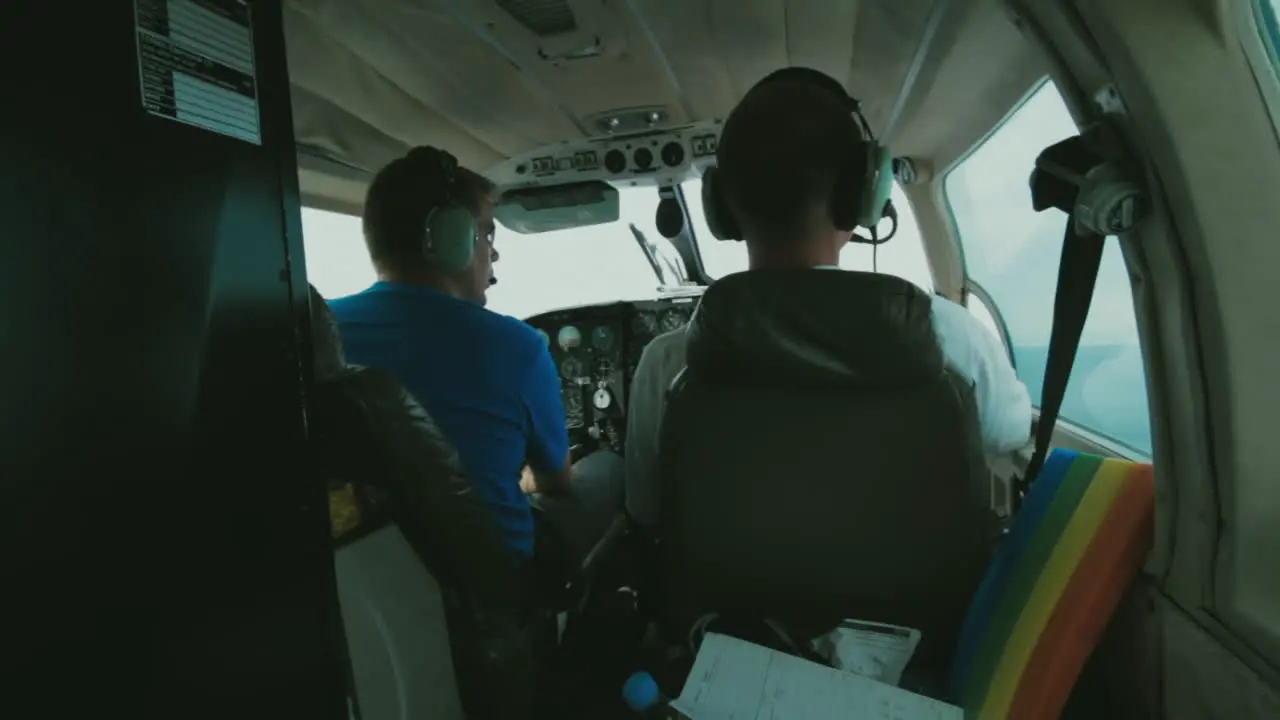 Panning Shot from Scientist in the Rear of a Plane to the Pilots in the Cockpit