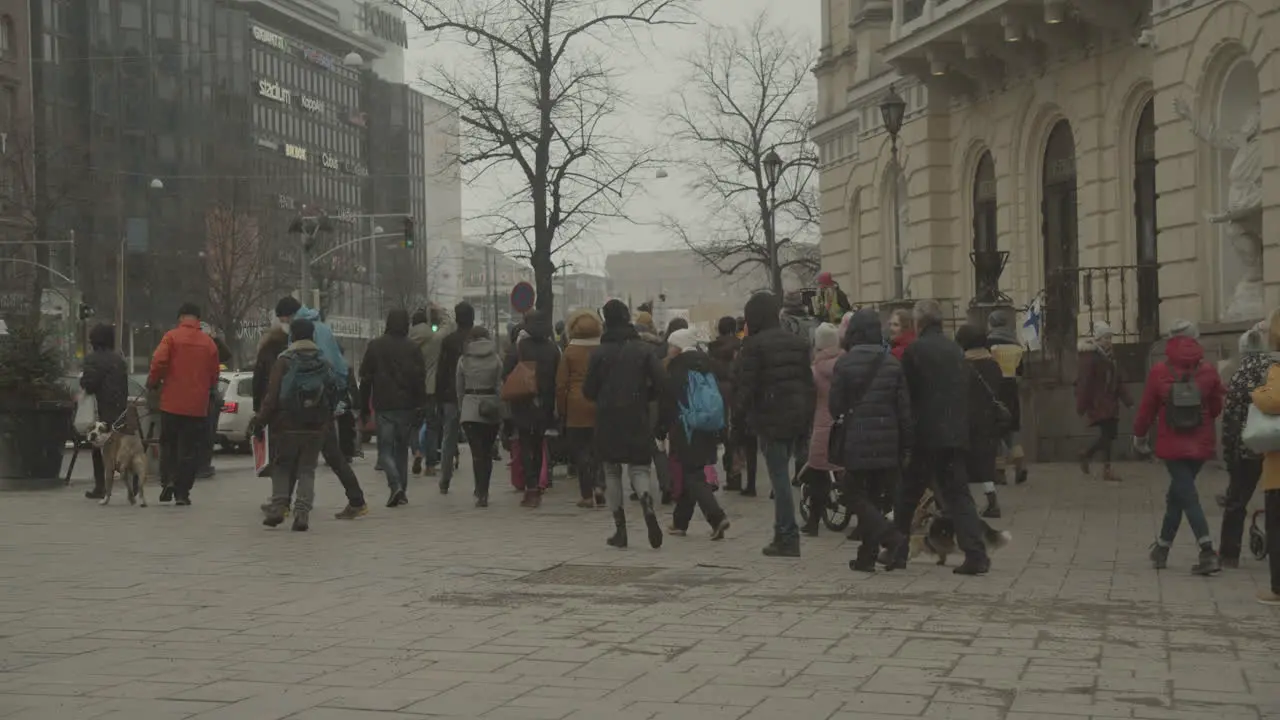 Crowd of people walking in the city street during a peaceful protest