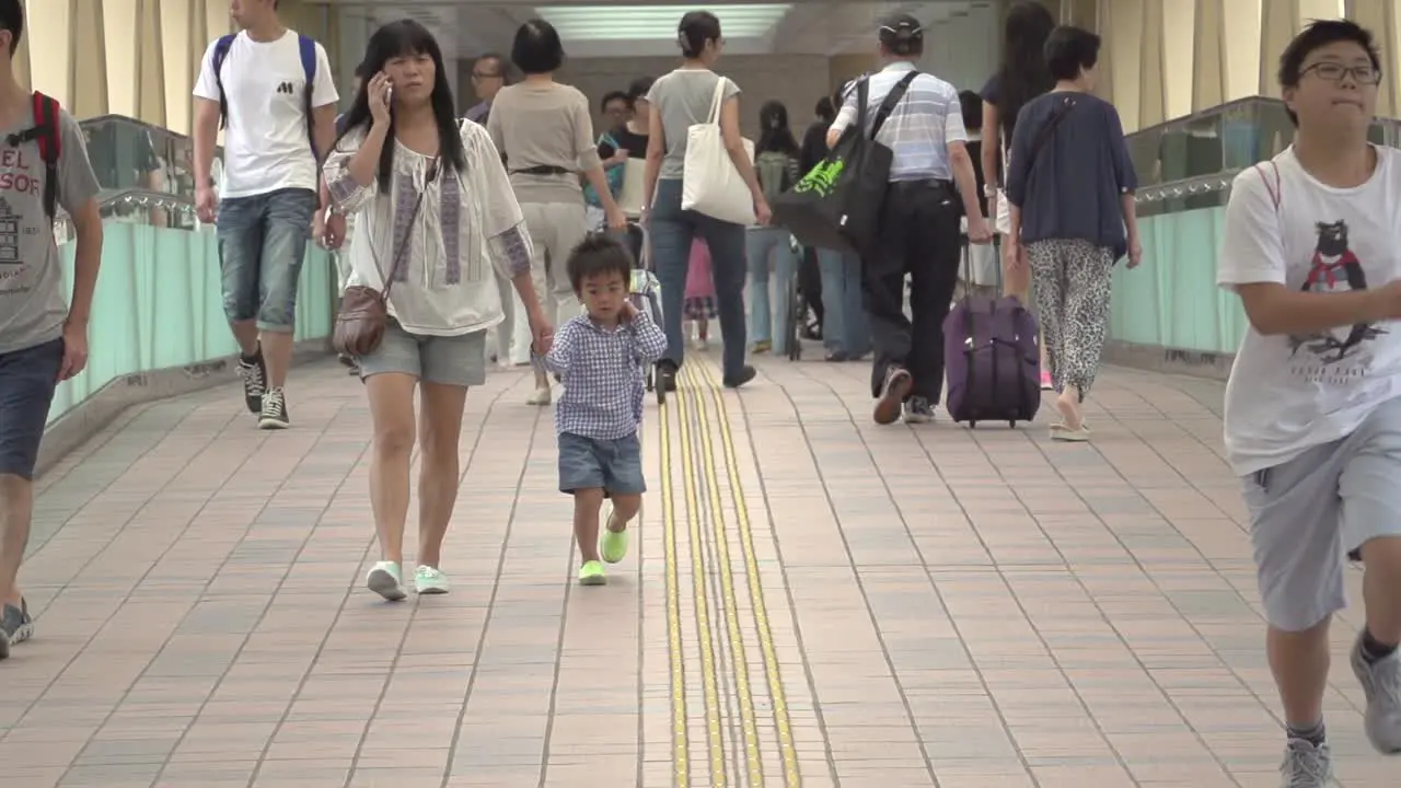 Slow motion shot of chinese people walking through the streets of Hong Kong