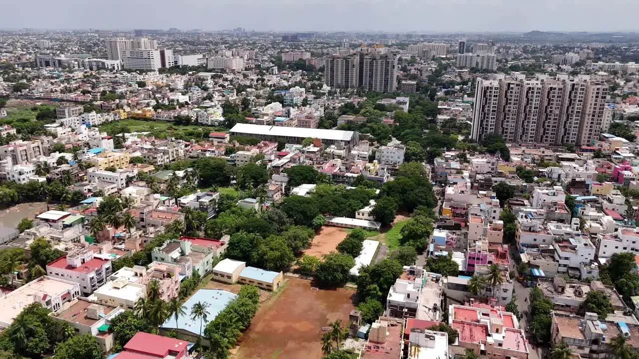 Aerial shot of congested city of Chennai with buildings and houses in India during daytime