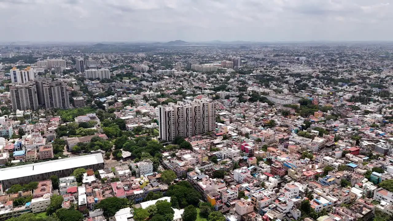 Aerial shot of tall apartments in between a crowded city during daytime in Chennai India