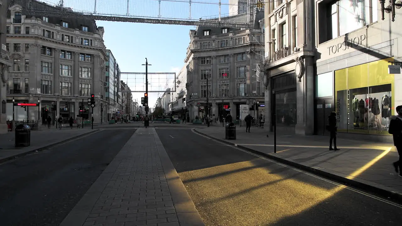 London in Covid-19 Coronavirus lockdown with quiet empty roads at Oxford Street and Oxford Circus with closed shops shut down at the popular shopping high street in the pandemic in England Europe