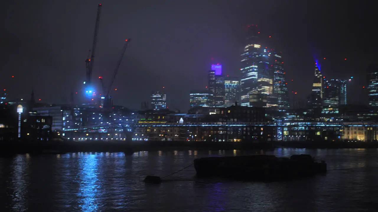 Panorama Of Millennium Bridge And The City By The River Thames At Night In London UK