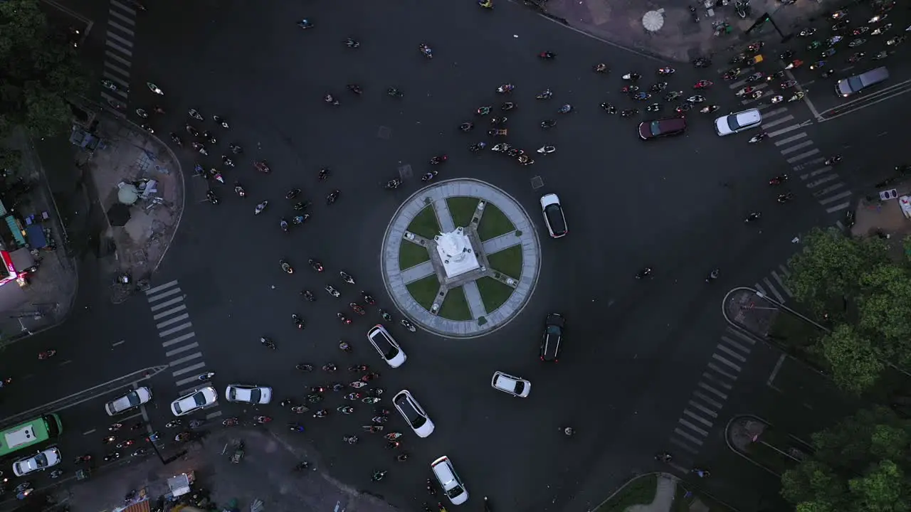 Traffic roundabout at night from top down drone shot