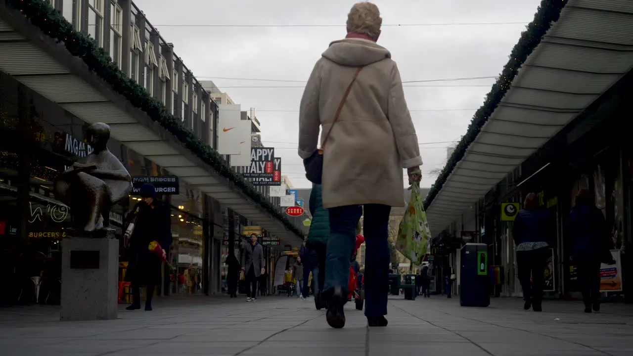 Shoppers and pedestrians walking on the Lijnbaan shopping street