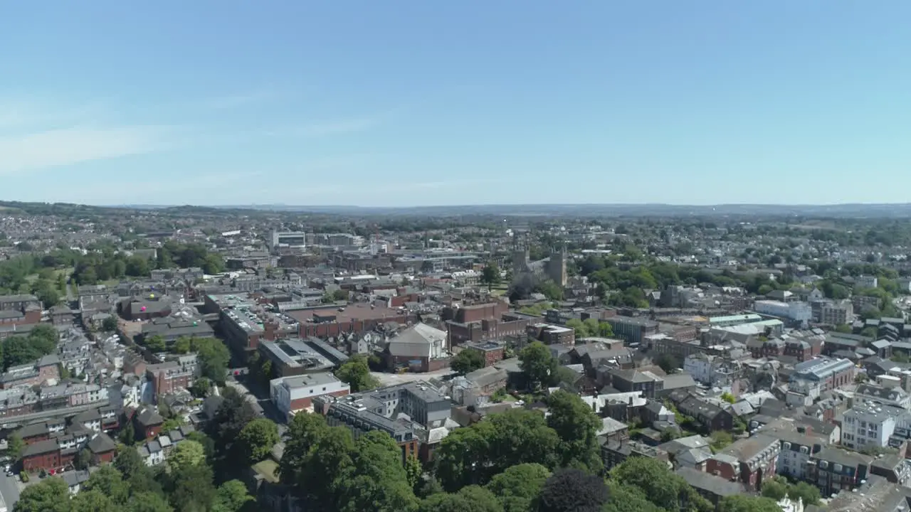 Aerial tracking back over a scenic exeter city centre