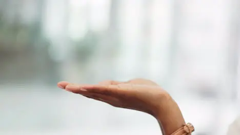 A woman hand open showing mockup space in the room