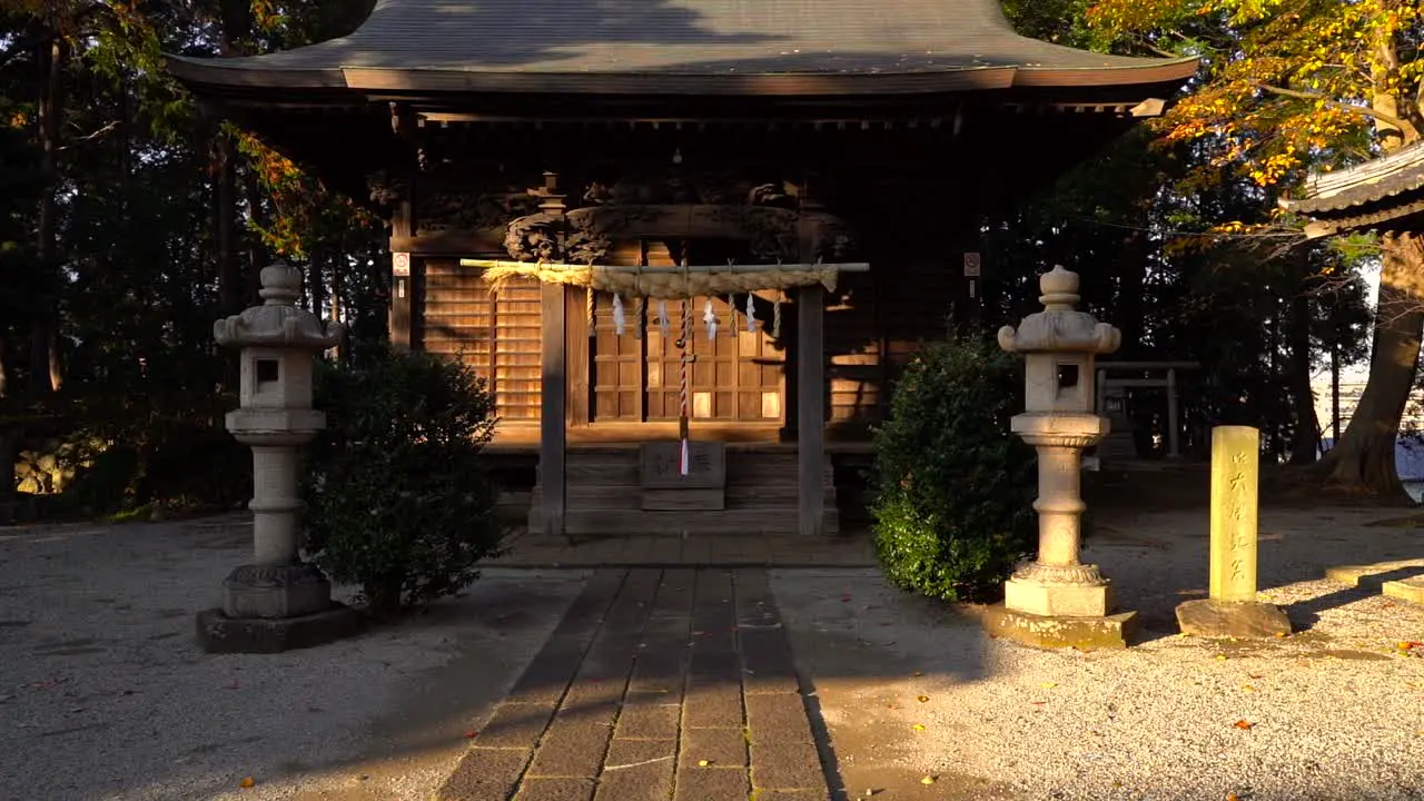 Slow motion push in to typical japanese shrine at sunset