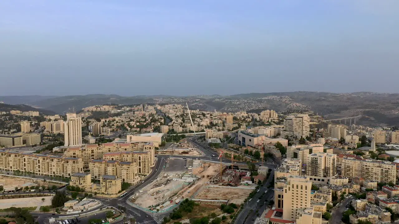 Aerial forward fly shot of Jerusalem's Chords Bridge and the city entrance area Israel