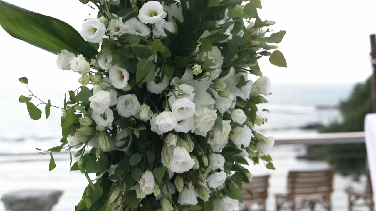 A set of flowers on a wedding hall by the sea