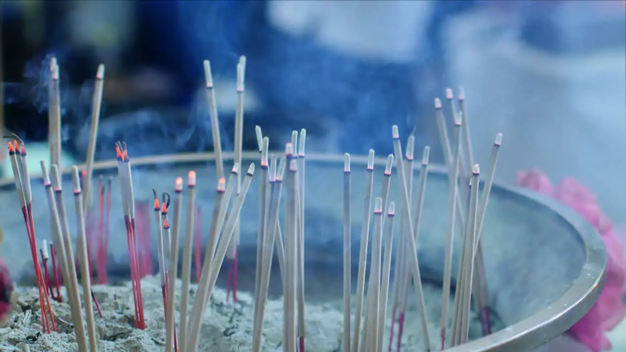 Selective focusing 4k video on the smoke stick for spiritual cultural in Chinese temple