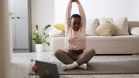 Woman stretching at home