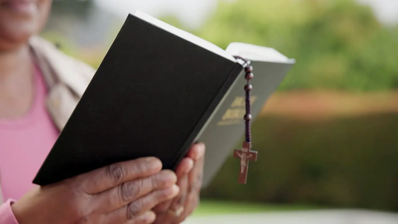 Senior woman bible study and reading with rosary