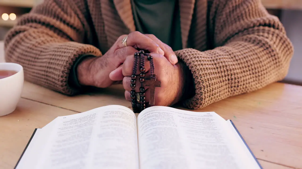 Hands cross and Bible with praying