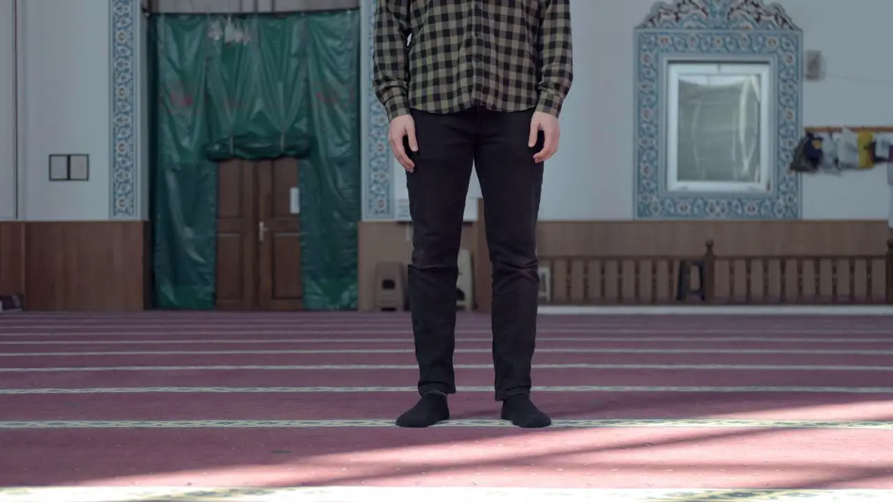 Masked Young Man Praying In Mosque