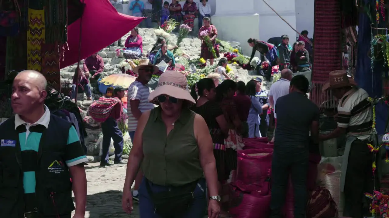 Indigenous market at the entrance of a colonial catholic church in Guatemala