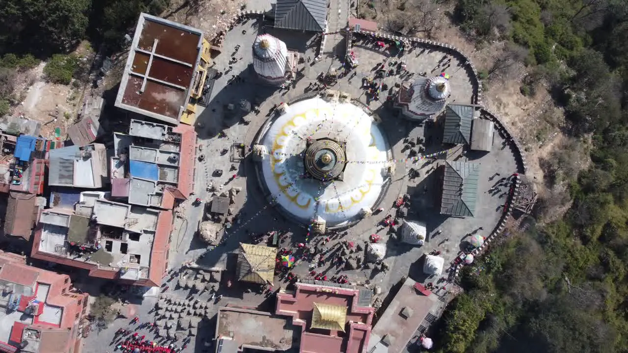 A rising straight down aerial view time-lapse of Swayambhunath Stupa in the city of Kathmandu Nepal