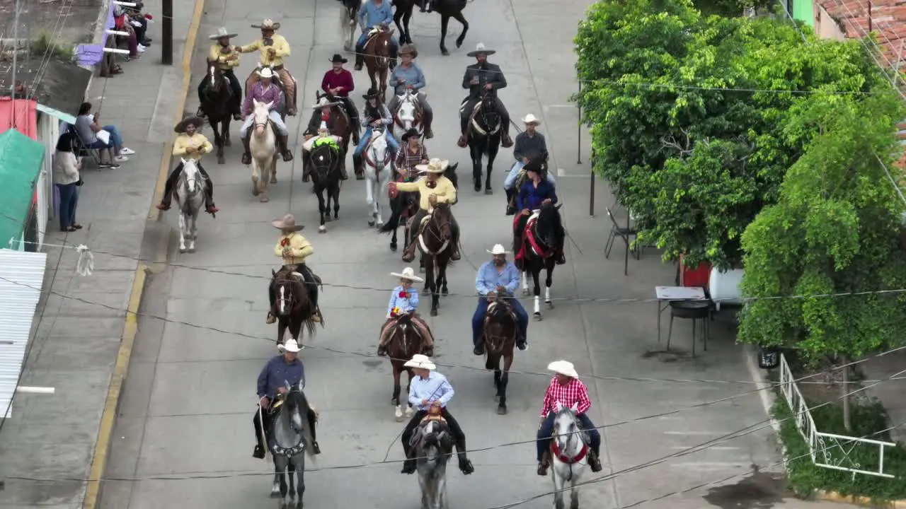 Mexican People Riding Horses On Street At Mariachi Festival Inaugural Parade In Tecalitlan Mexico