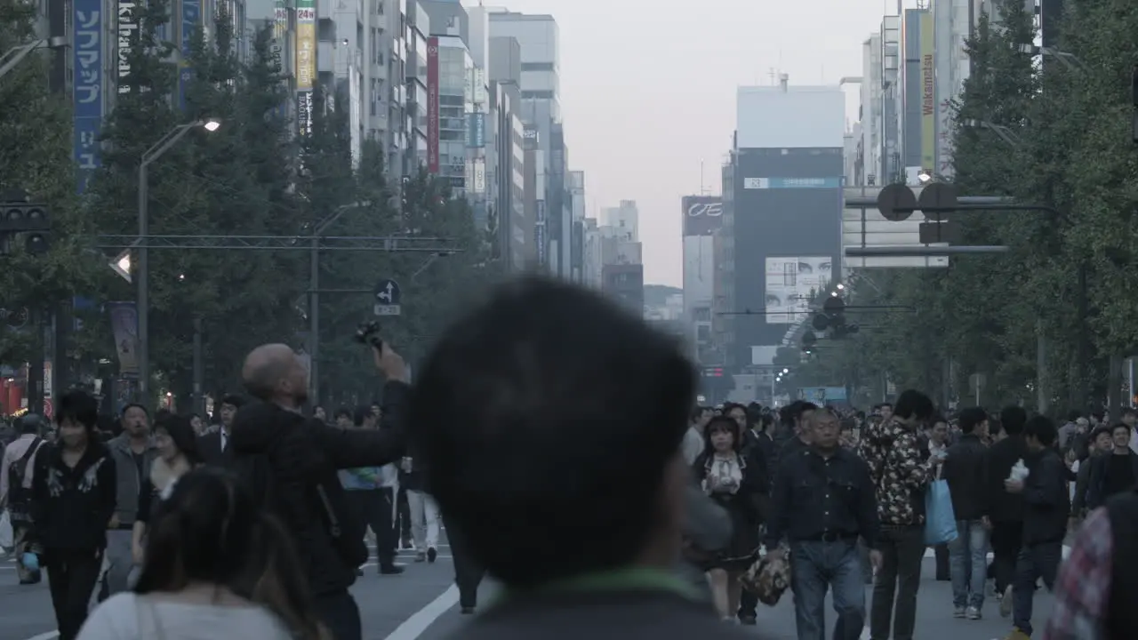 Crowds of people walking in the street in Tokyo Japan