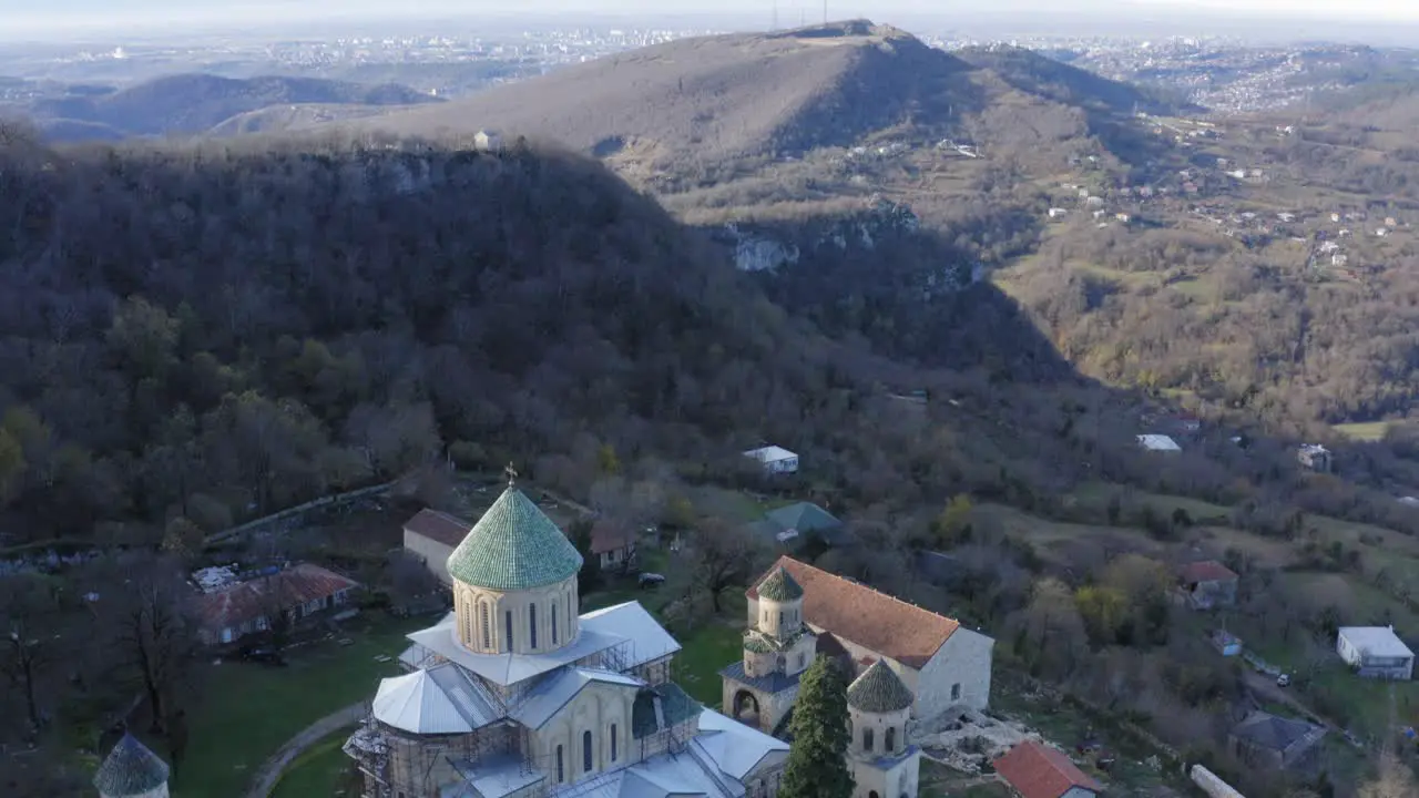 Aerial of Martvili Monastery in between mountains in Kutaisi Georgia