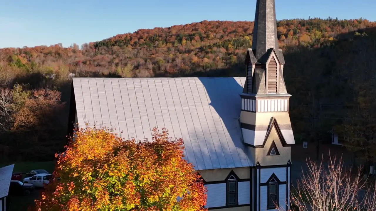 East Orange Vermont Church aerial tilt up from sugar maple