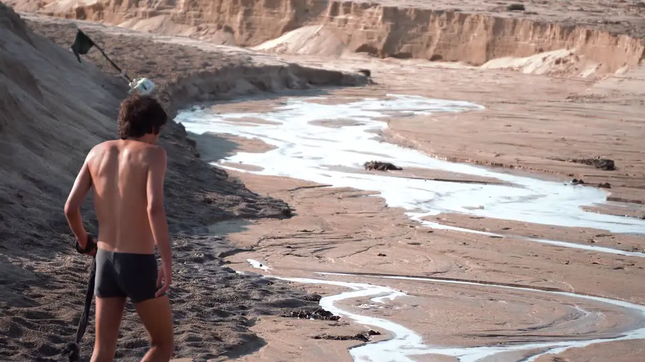 Two men walking in the beach