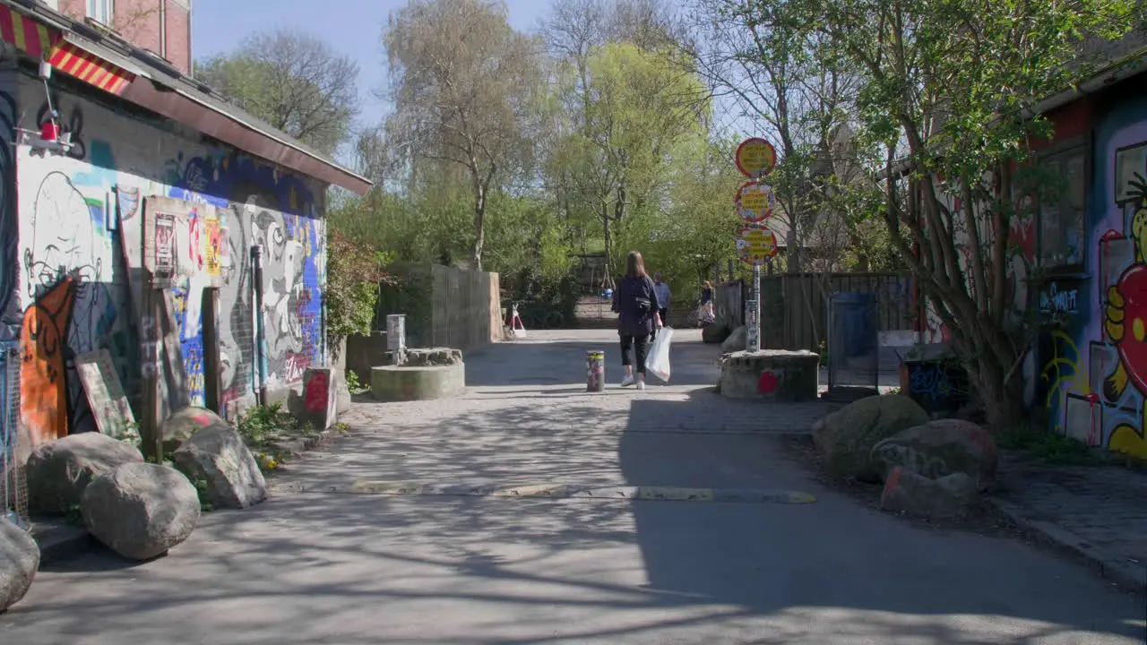 Urban walkway with vibrant street art in Christiania Copenhagen