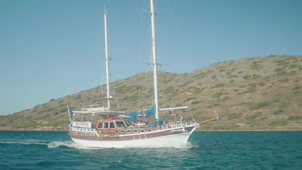 Wide shot of historical boat cruising across the ocean