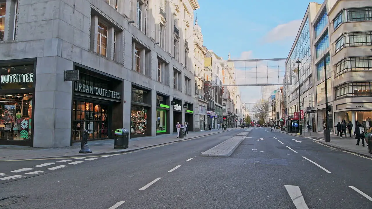 London in Covid-19 Coronavirus lockdown with quiet roads at Oxford Street with closed shops shut at the popular shopping high street in the pandemic in England Europe