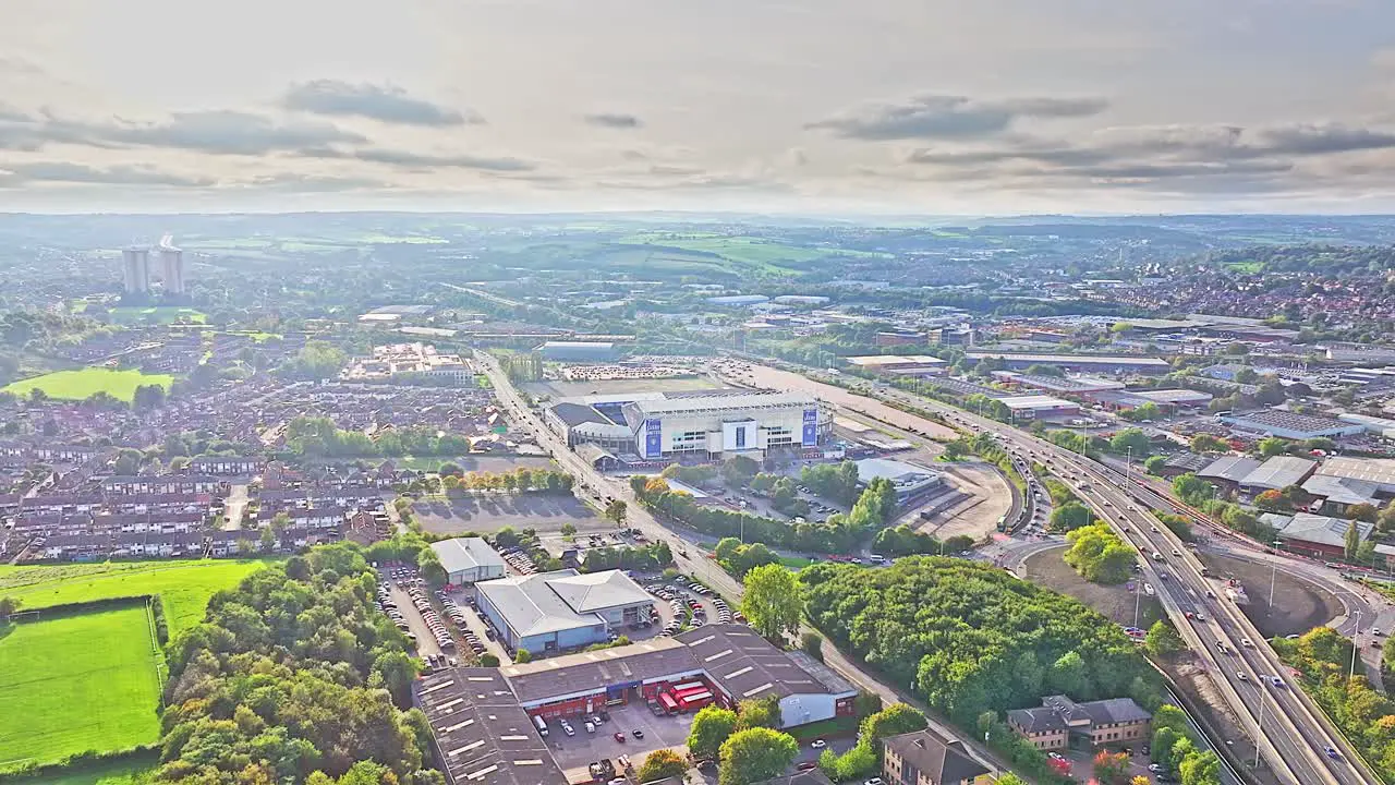 Wide angle establishing drone shot Leeds city and suburbs in England