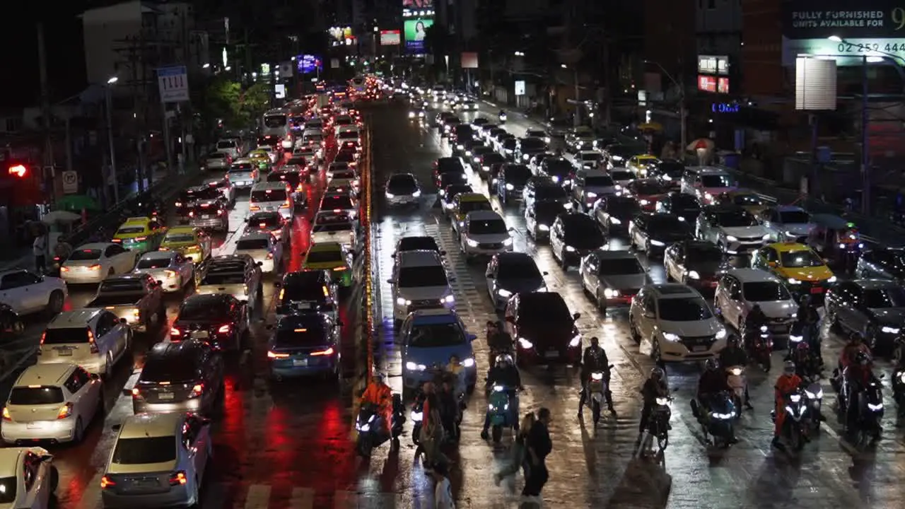 People Walking Across The Busy Asoke Montri Crosswalk In Downtown Bangkok 