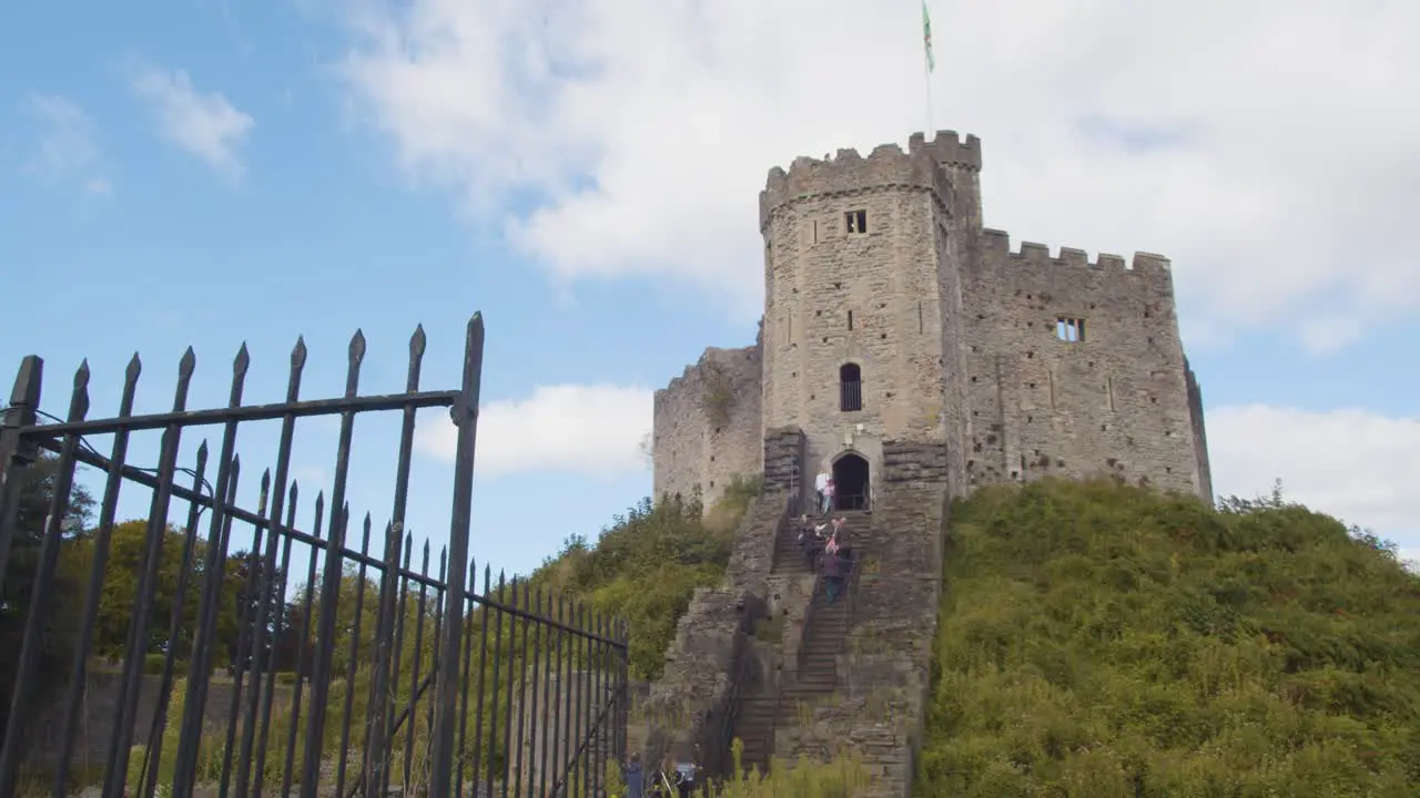 Welsh Flag Flying From Cardiff Castle Against Blue Sky 2