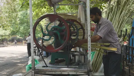 Street Food Vendor Crushing Sugar Cane In Bangalore India