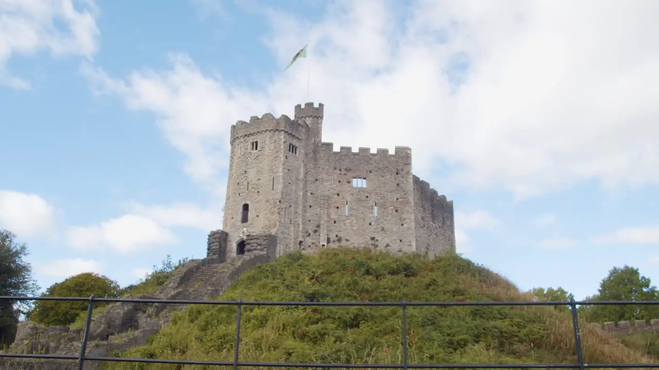 Welsh Flag Flying From Cardiff Castle Against Blue Sky 1